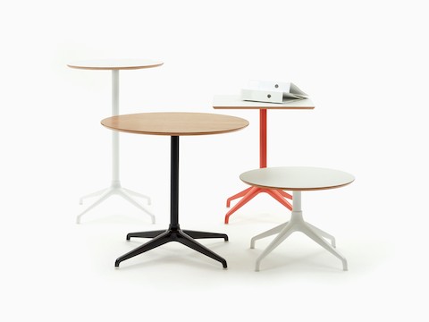 Four Ali Tables in different sizes and heights, all with 4-star bases in a variety of colours.
