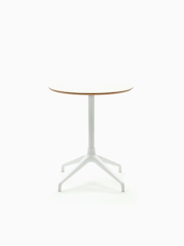 An Ali Café Table with a white 4-star base and white circular table top.