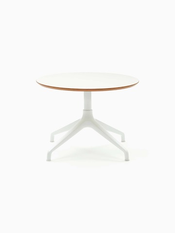 An Ali Coffee Table with a white 4-star base and circular white table top.