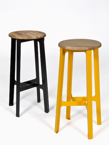 Two bar-height NaughtOne Construct Stools, one black and one yellow.