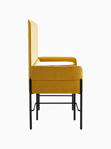 Standard-height Hue Booth, upholstered in yellow velvet with black legs and white table top, viewed from the side.