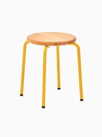 A Penny Stool with a yellow base and oak seat.