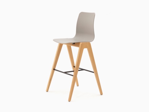 A tan NaughtOne Polly Wood Stool with an oak base, viewed at an angle. A tan NaughtOne Polly Wood Stool with an oak base, viewed at an angle.