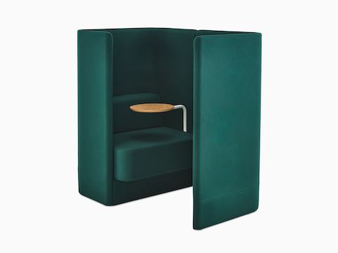 Three-quarter angle of Pullman Chair Pod upholstered in a dark green fabric, with tablet arm and screen to the left.