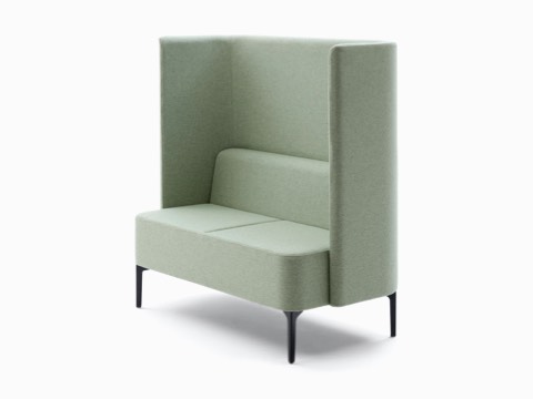 Two-seat Pullman Sofa, upholstered in pale green fabric with black legs.
