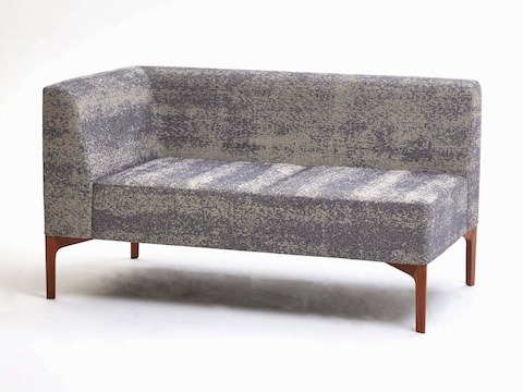 A gray patterned 2-seat Symbol Modular Seating piece with a right armrest and wooden legs.