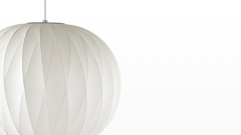 Close view of the Nelson Ball CrissCross Bubble Pendant white hanging lamp.