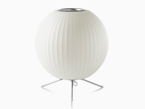A white Nelson Ball Tripod Lamp.