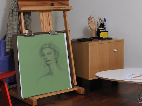 A small closed storage module from the Nelson Basic Cabinet Series in an artist's studio. 