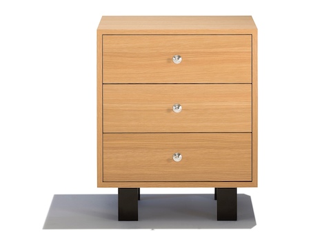 A small Nelson Basic Cabinet Series storage module with three box drawers and a light finish. A small Nelson Basic Cabinet Series storage module with three box drawers and a light finish.