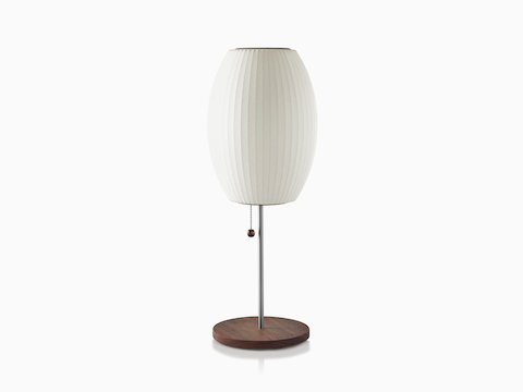 A white Nelson Cigar Lotus Table Lamp with a walnut-covered steel base.