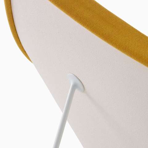 Close-up of the attachment point for one of the three steel legs on a Nelson Coconut Lounge Chair. Close-up of the attachment point for one of the three steel legs on a Nelson Coconut Lounge Chair.