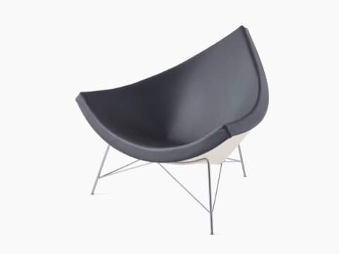 A black leather Nelson Coconut Lounge Chair, viewed from a 45-degree angle. 