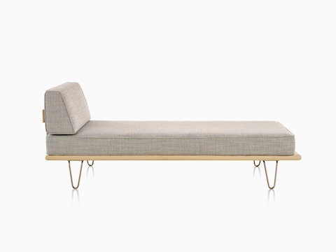 A light gray Nelson Daybed in the lounge position with a removable side bolster in place.