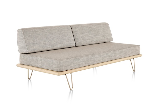 A light grey Nelson Daybed in the sofa position, viewed from a 45-degree angle. A light grey Nelson Daybed in the sofa position, viewed from a 45-degree angle.