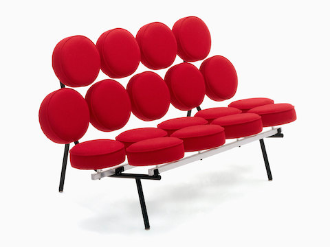 A Nelson Marshmallow Sofa upholstered in red fabric, viewed from a 45-degree angle.