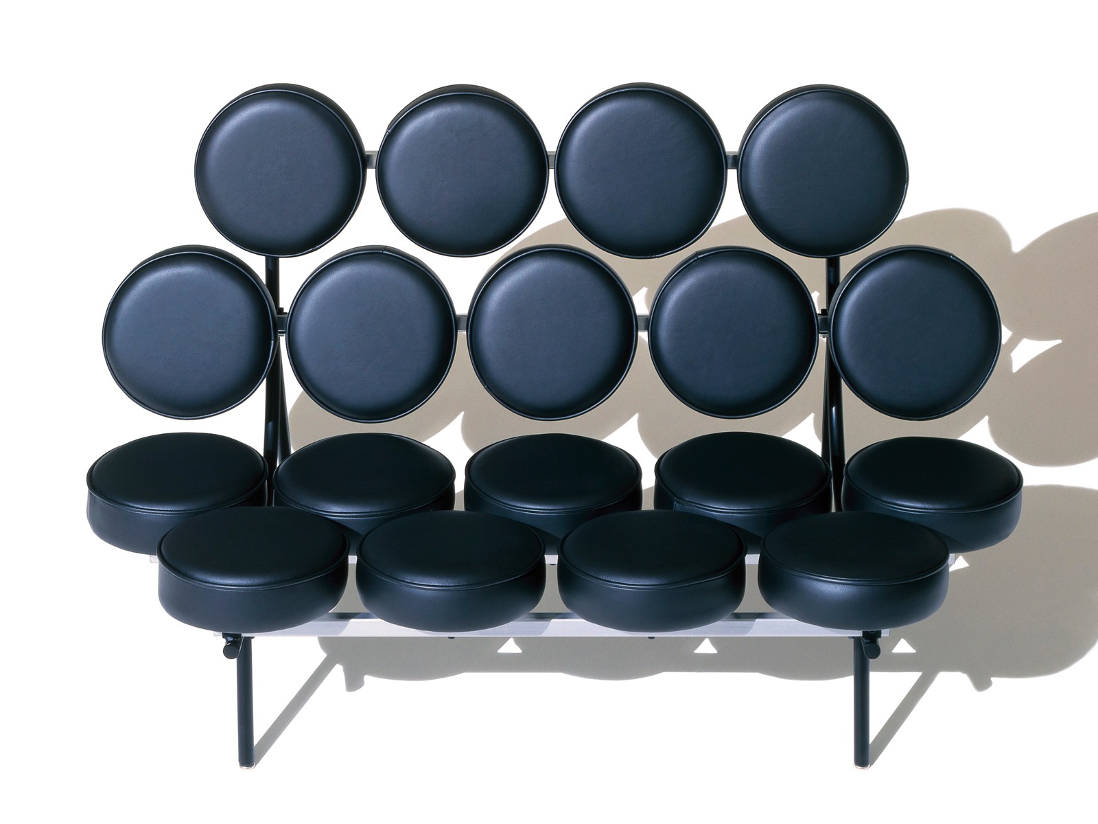 A black leather Nelson Marshmallow Sofa, viewed from the front.