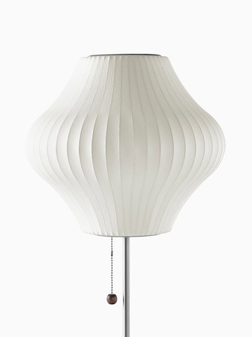 A white table lamp. Select to go to the Nelson Pear Lotus Table Lamp product page.
