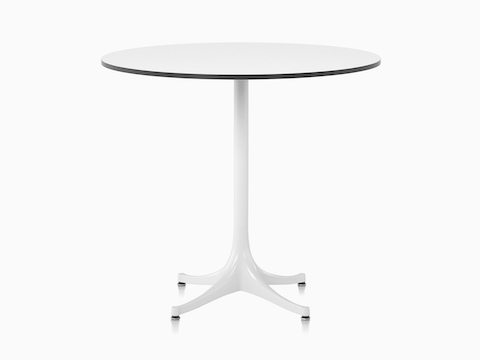Una mesa de pedestal redonda Nelson con una tapa laminada blanca y base blanca.