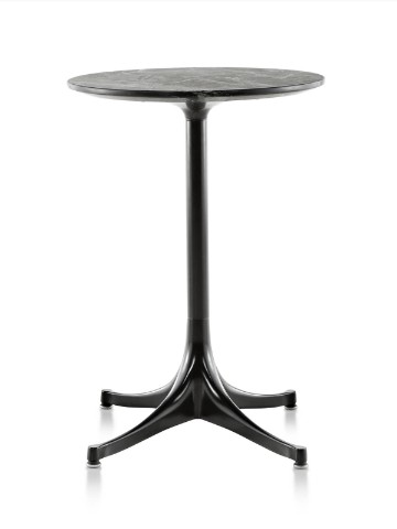 A round Nelson Pedestal outdoor side table with a black stone top and black base. A round Nelson Pedestal outdoor side table with a black stone top and black base.