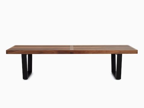 Walnut Nelson Platform Bench with ebonized wood legs, viewed from the front.