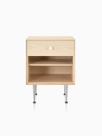 A Nelson Thin Edge bedside table with a light finish, white knob, and slim aluminum legs.
