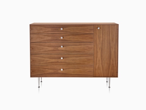 A Nelson Thin Edge chest combining five drawers and one cabinet in a medium finish. 