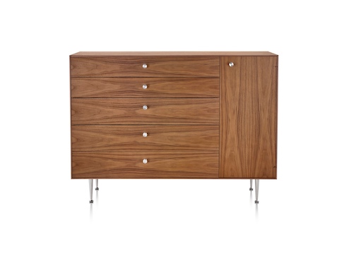 A Nelson Thin Edge chest combining five drawers and one cabinet in a medium finish. A Nelson Thin Edge chest combining five drawers and one cabinet in a medium finish.