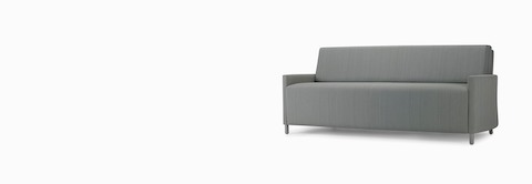 A three-quarter view of a Pamona Flop Sofa in gray textile with metal legs.