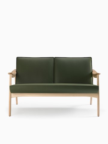 A front-facing view of an Aspen lounge settee in green textile with maple base and arms.