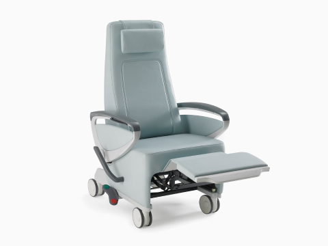 Nemschoff Ava Recliner with arcade back in a light blue upholstery with panel arms and the footrest extended, viewed from an angle.