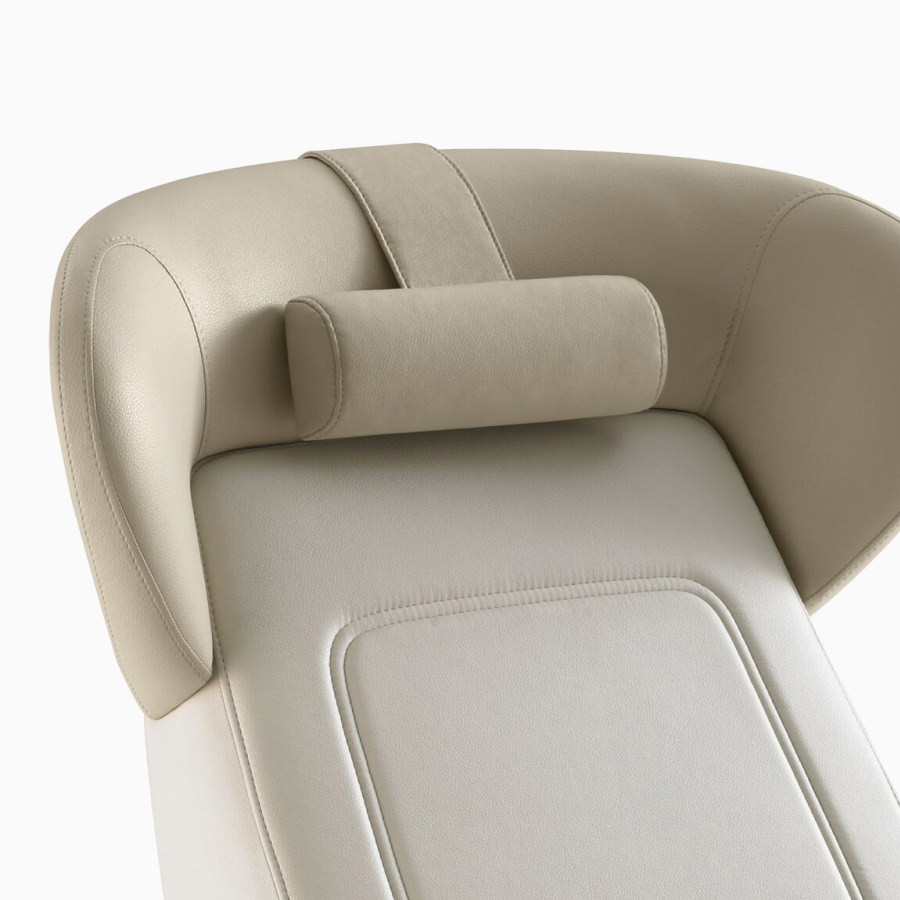 Nemschoff Ava Recliner with wingback and neck pillow in two beige upholsteries.