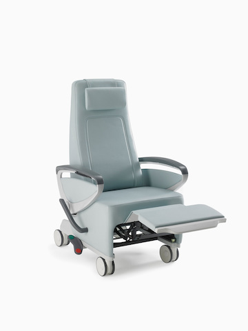 Nemschoff Ava Recliner with arcade back in a light blue upholstery with panel arms and the footrest extended. Select to go to the Nemschoff Ava Recliner product page.