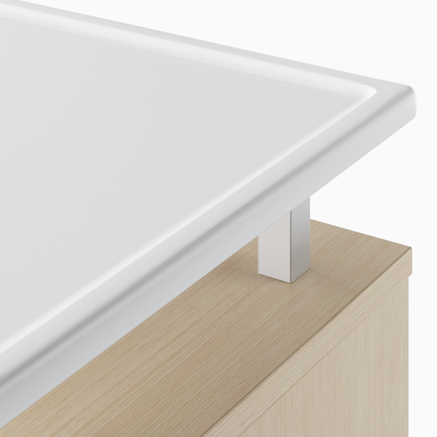 A close-up view of the raised top in a white Corian.