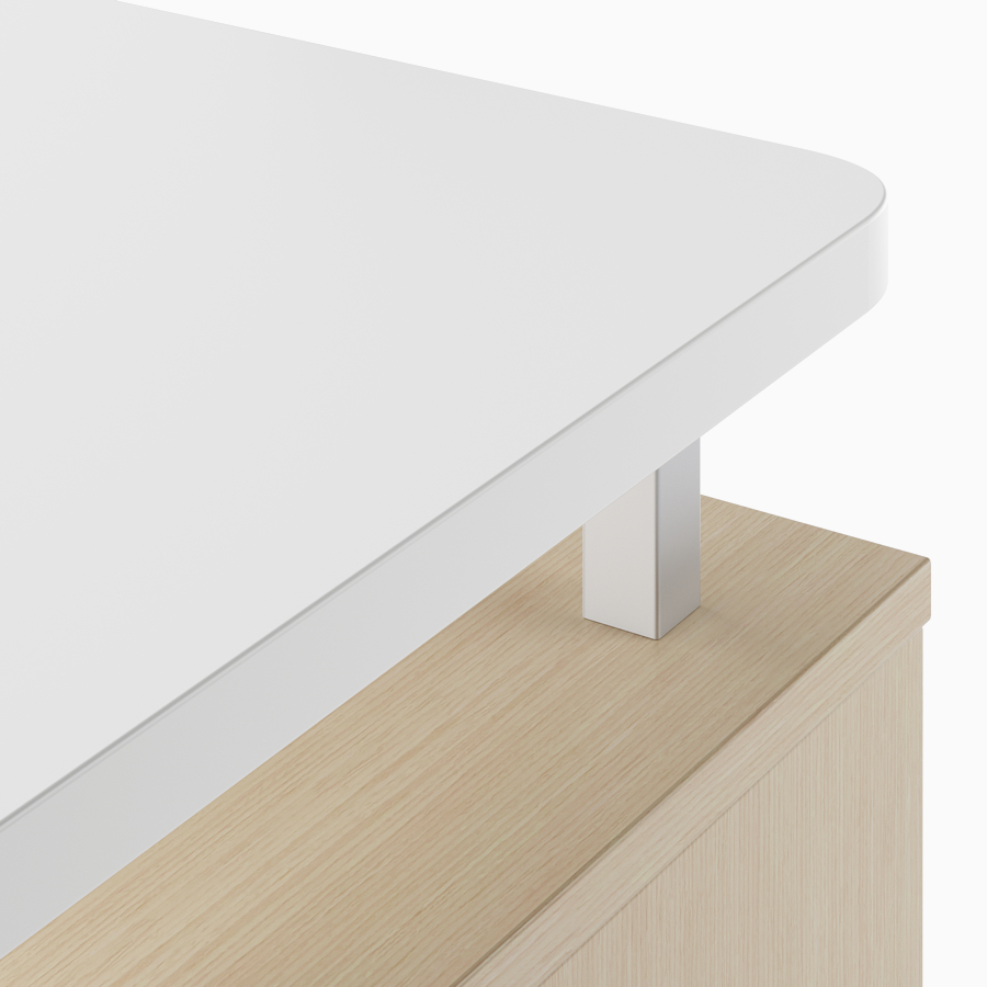A close-up view of the raised top in a white laminate.