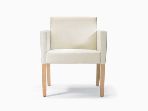 A front view of a Brava 862 Chair with maple frame, upholstered arm caps, and white textile.