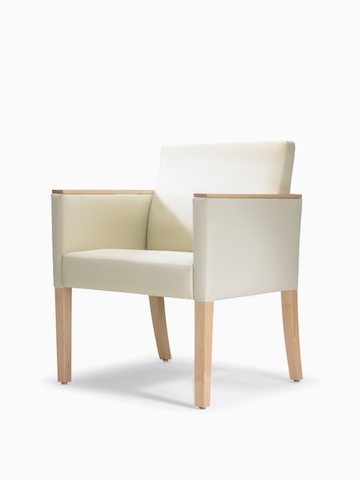 A three-quarter view of a Brava 862 Chair with maple frame, maple arm caps, and white textile.