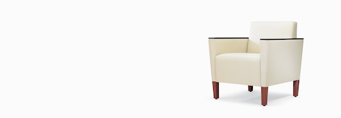 A three-quarter view of a Brava Classic Lounge Chair with white textile and urethane arm caps. A three-quarter view of a Brava Classic Lounge Chair with white textile and urethane arm caps.