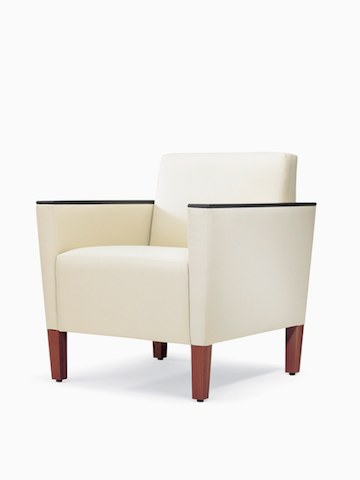 A three-quarter view of a Brava Classic Lounge Chair with white textile and urethane arm caps.