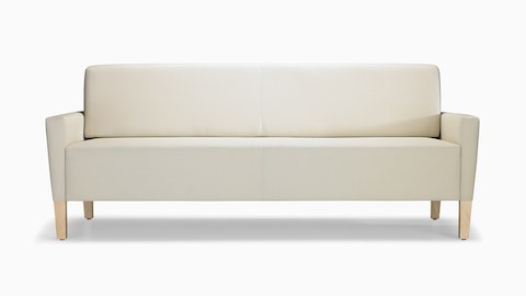 A front view of a Brava Flop Sofa in white textile with maple legs.