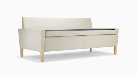 A Brava Flop Sofa in white textile with maple legs ready to unfold.