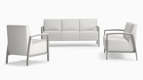 A trio of Brava Modern Lounge Seating configurations, consisting of one chair, a two seat, and three seat, all in white fabric with silver solid surface arm caps.