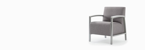Front three-quarter view of a gray Brava modern lounge chair with solid surface arm caps.