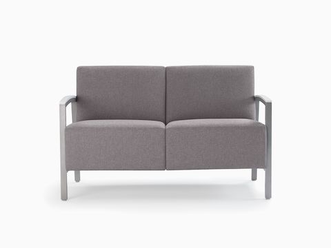 Front view of a gray Brava Modern Lounge Seating two-seat chair with solid surface arm caps.