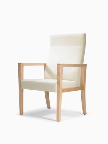 A three-quarter view of a Brava 863 high back patient chair in white textile with open maple wood arms.