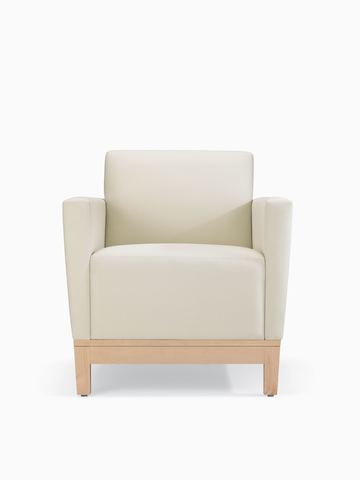 A front view of a Brava Platform Chair with upholstered arms in white textile with maple base.
