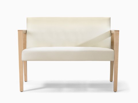 A front view of a Brava 863 plus chair in white textile with open maple wood arms.