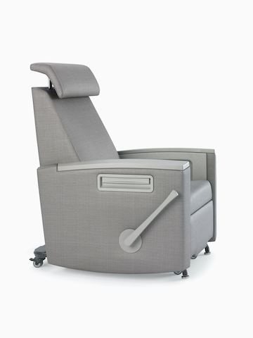 Three-quarter view of Consoul Reclining Glider with adjustable headrest in up position. Pewter urethane arm caps and in-arm storage. Upholstered in Maharam Stature Stealth.