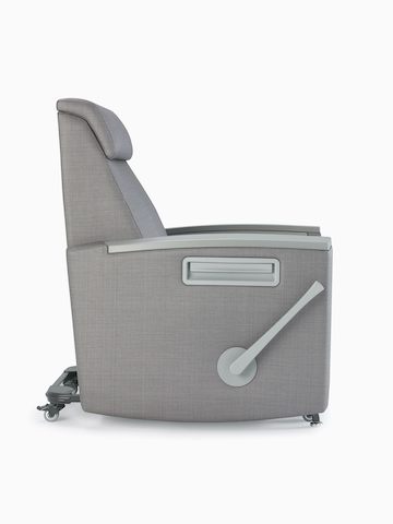 Side view of Consoul Reclining Glider showing footrest handle. Pewter urethane arm caps and in-arm storage. Upholstered in Maharam Stature Stealth.