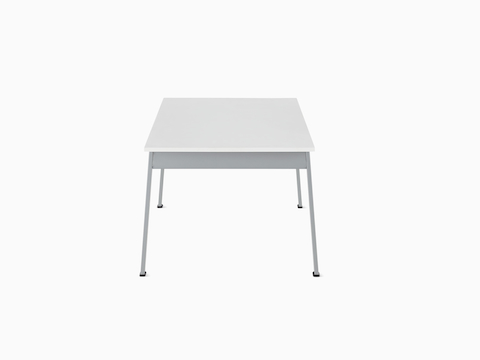 Side view of an Easton Coffee Table with a glacier white Corian top and metallic silver legs.